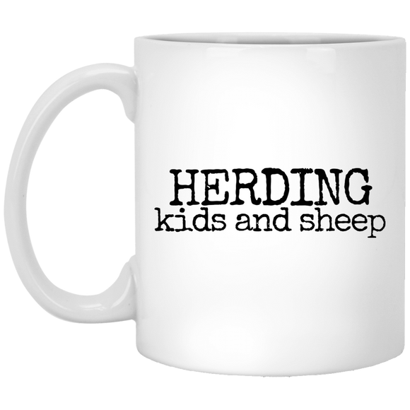 herding kids and sheep black Mugs